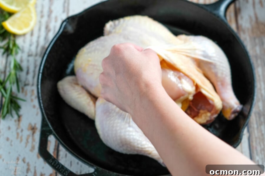 Golden Roast Chicken 5 A close-up of a raw whole chicken, properly cleaned and ready for seasoning.