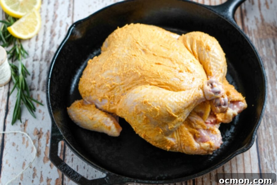 Golden Roast Chicken 8 Chicken legs tied together with kitchen twine, showcasing the trussing technique.