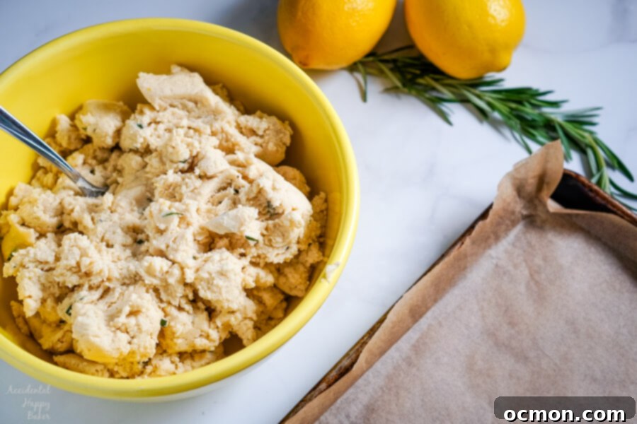 Close up of Lemon Rosemary Cookies, simple fresh flavors of lemons and rosemary meld together in these buttery shortbread cookies to make an unassuming cookie with a dynamic flavor combination.