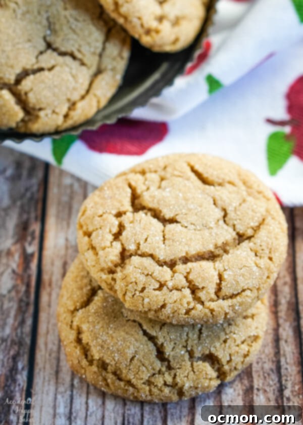 Chewy French Toast Cookie Bliss 7 A stack of two French toast cookies on a plate with more cookies in the background, ready to be enjoyed.