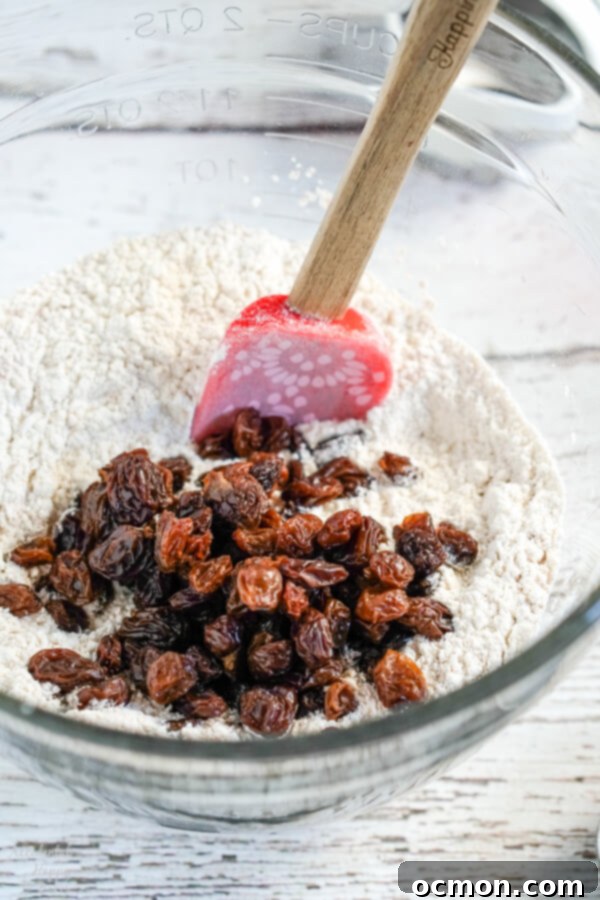 Delightful Cinnamon Raisin Biscuits 5 Close up of raisins soaking in a bowl of hot water.