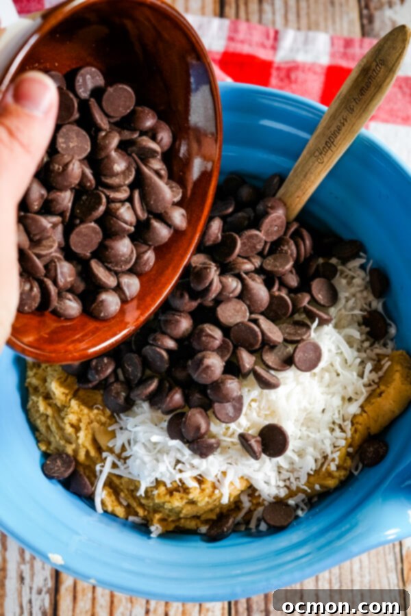 Dark chocolate chips and coconut is added to the cookie dough.