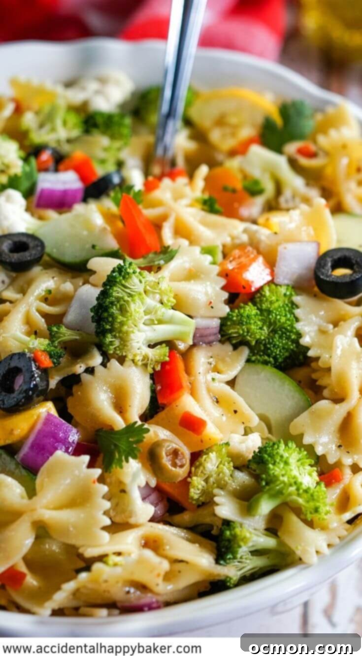 Vibrant Summer Veggie Pasta 8 A beautifully presented Summer Vegetable Pasta Salad, bursting with colorful fresh vegetables and farfalle pasta, all coated in a zesty Italian dressing. Perfect for picnics, BBQs, and healthy summer eating.