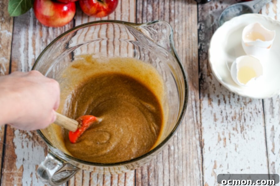 A 9x13 inch baking pan filled with freshly baked apple cinnamon bars, golden brown and ready to be sliced.