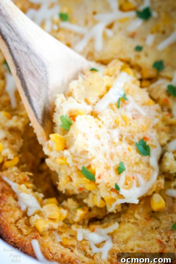 Creamy Slow Cooker Corn Bake 3 A close-up shot of Crock Pot Corn Casserole, showcasing its golden-brown top and soft interior.