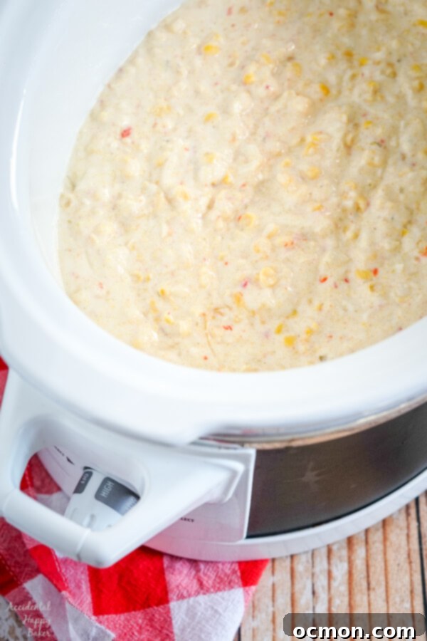 Creamy Slow Cooker Corn Bake 4 All the ingredients for Crock Pot Corn Casserole laid out on a wooden surface.