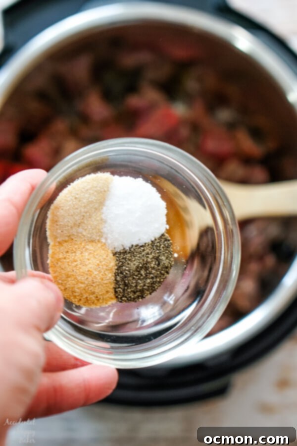 Adding the seasonings to the beef in the instant pot. 