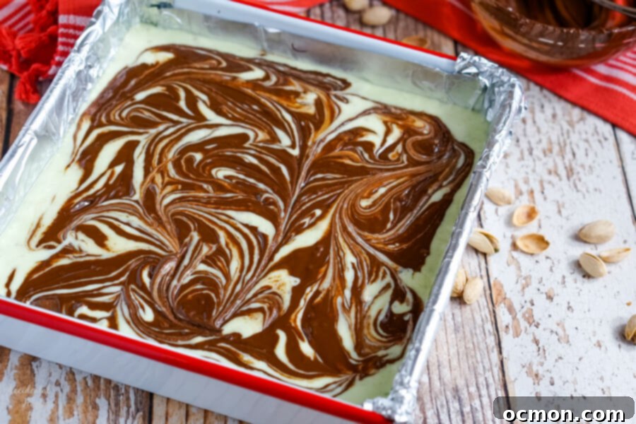 After the chocolate is swirled into the pistachio fudge place it in the fridge to set. 
