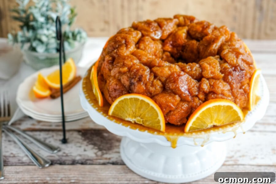 Citrus Spice Pull-Apart Bread 3 A plate of Orange Spiced Monkey bread beside a plate with sliced oranges.