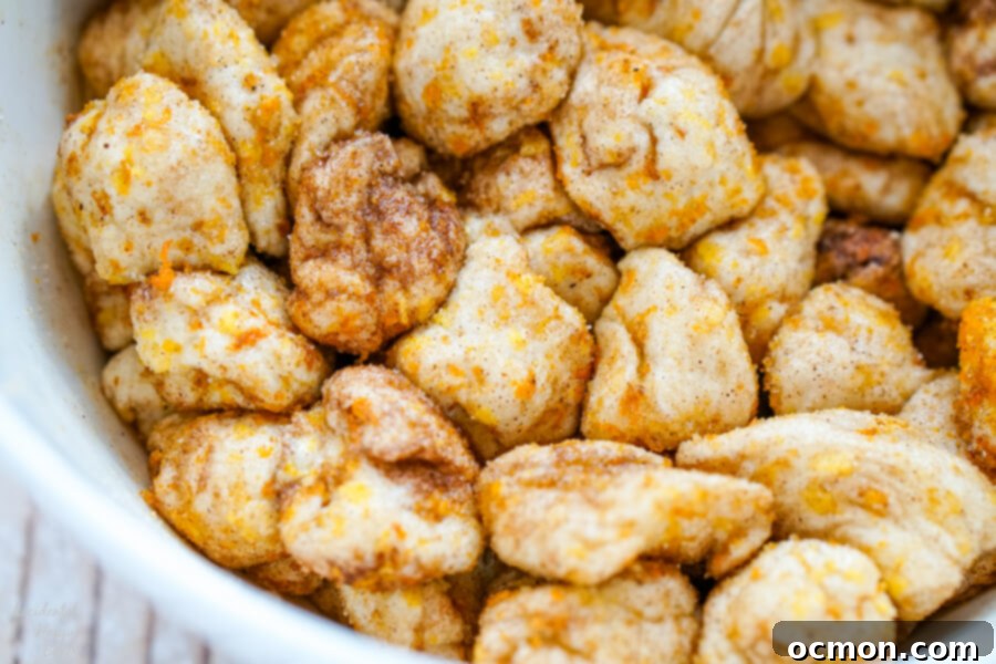 Citrus Spice Pull-Apart Bread 6 The biscuit pieces are rolled in the sugar mixture.