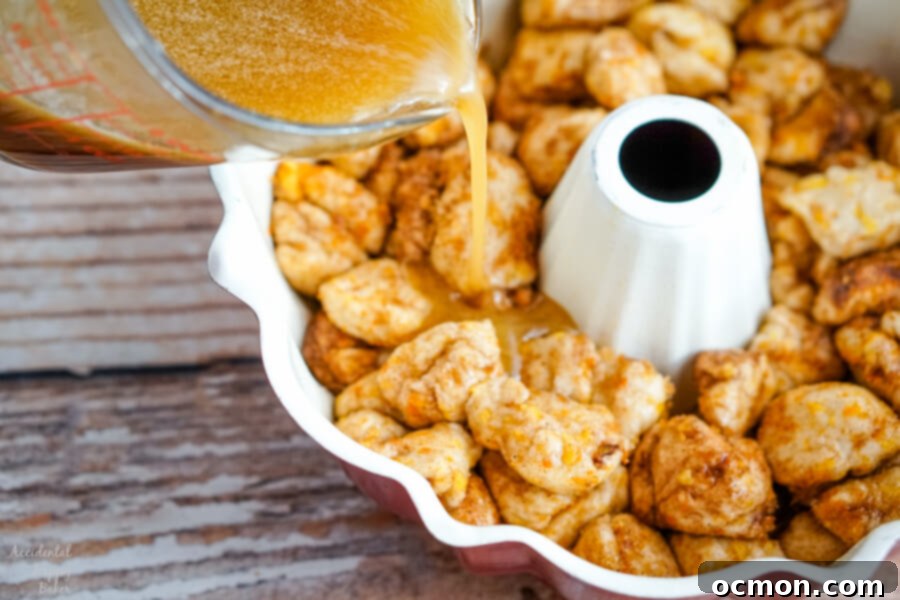 Citrus Spice Pull-Apart Bread 7 The orange syrup is poured over the biscuits in the bundt pan.