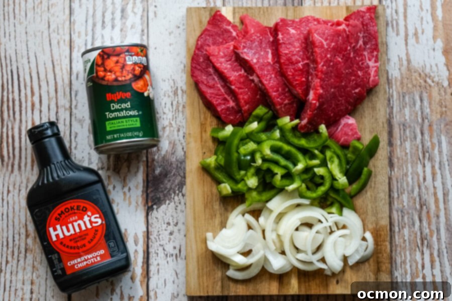 The ingredients needed for Instant Pot BBQ Swiss Steak; round steak, bell peppers, onion, canned tomatoes and barbecue sauce. 