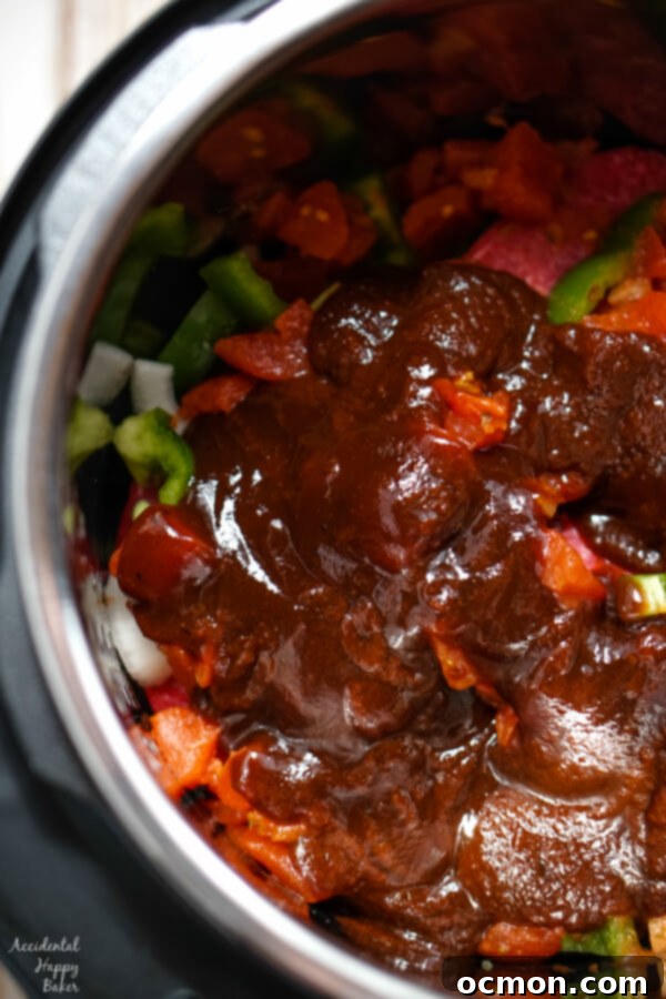 Barbecue sauce is added to the instant pot. 