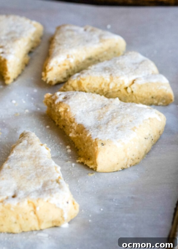Unbaked scones on a baking tray lined with parchment paper. 