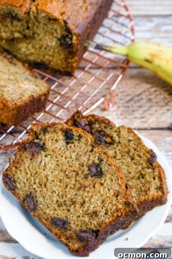 A close up of two slices of banana bread that show the chocolate chunks and the texture of the finished bread. 
