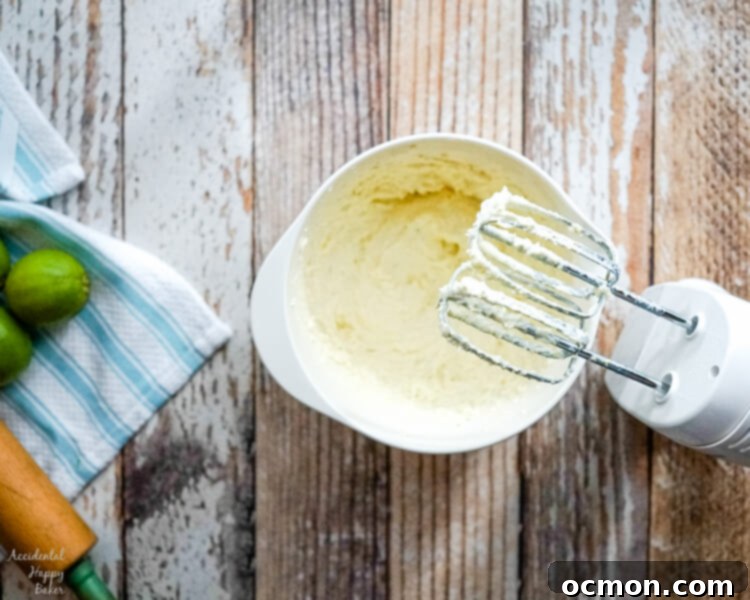 Butter and cream cheese are whipped together as the first step in Key Lime Pie Shortbread Cookies. 