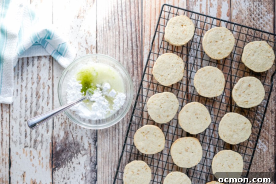 After chilling, the cookies are sliced and baked. A bowl with the ingredients for the glaze is ready to be mixed. 