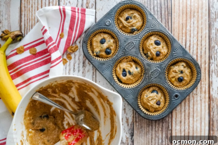 Wholesome Blueberry Bran Muffins 7 A cooling rack filled with freshly baked, perfectly domed blueberry bran muffins, ready to be enjoyed.