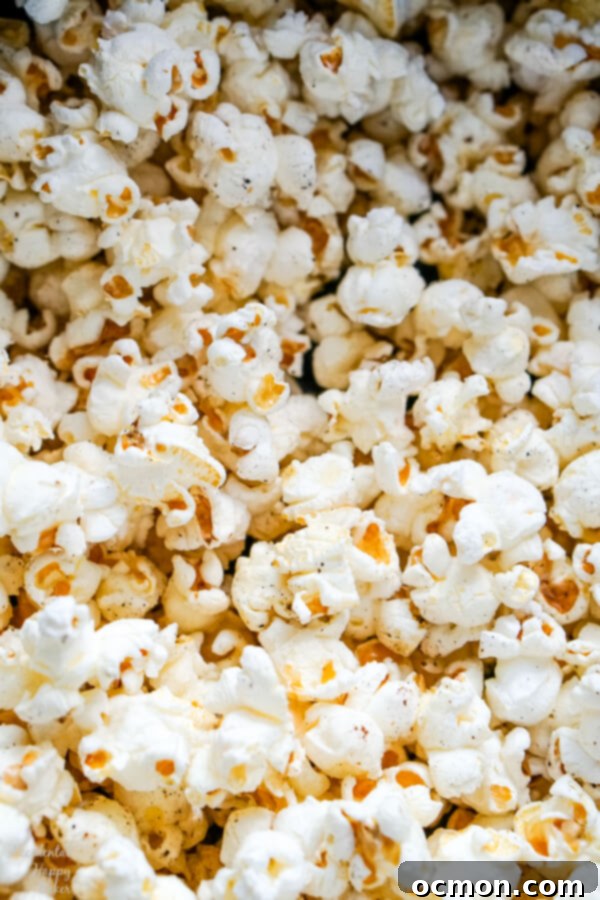 A close up image of the finished popcorn that shows the textures and seasonings.