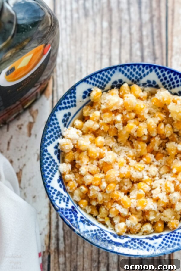 Popcorn kernels are mixed with sugar, and maple syrup before being added to the Dutch oven. 