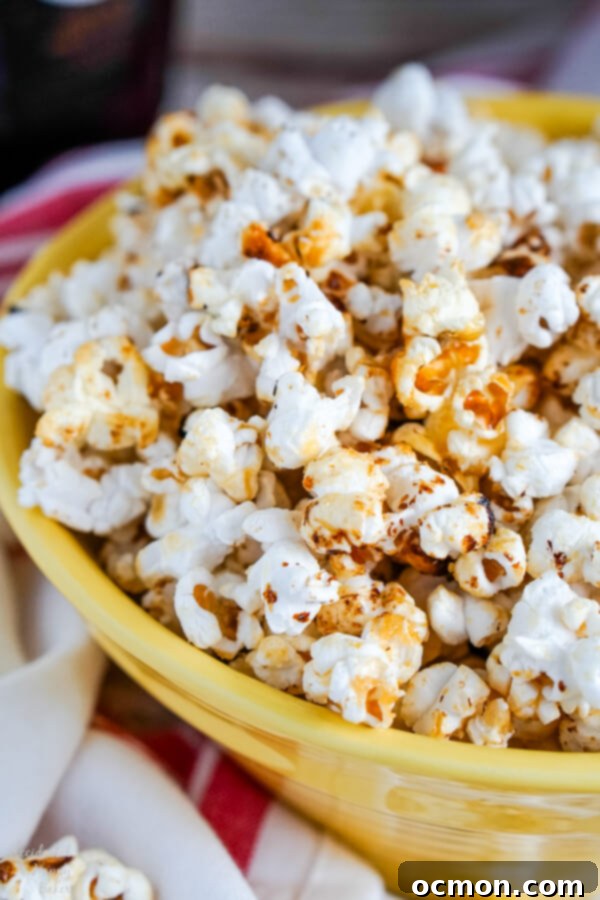A close up of a yellow bowl full of Kettle Corn.