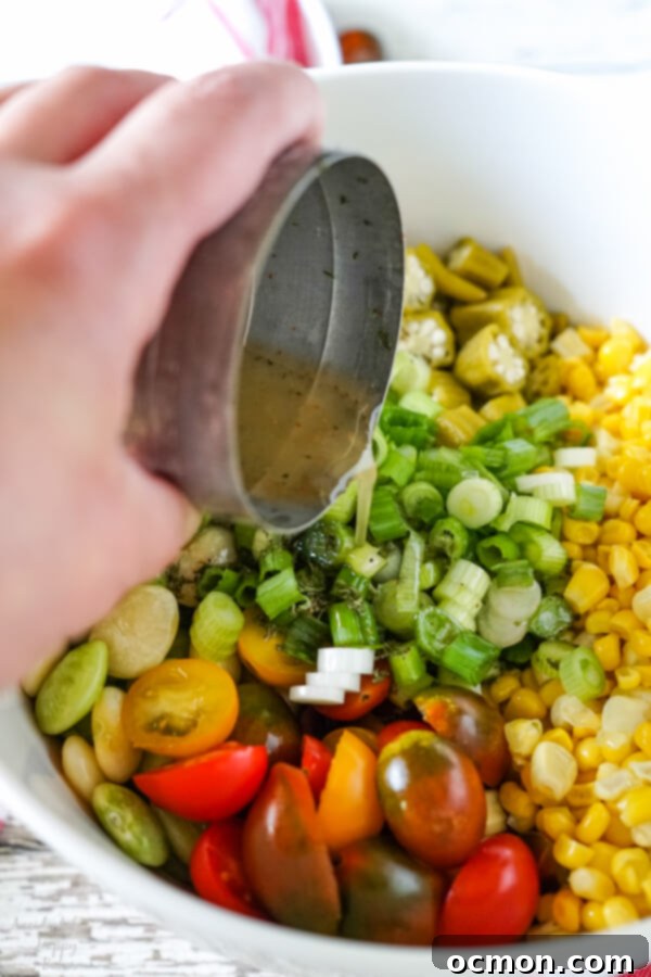 A jar of regular pickled okra, highlighting the key ingredient for the salad and its vinaigrette.
