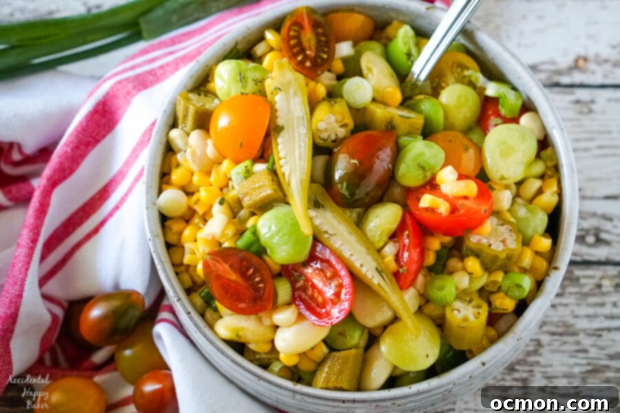 A bowl of Succotash Salad accented with slices of pickled okra.