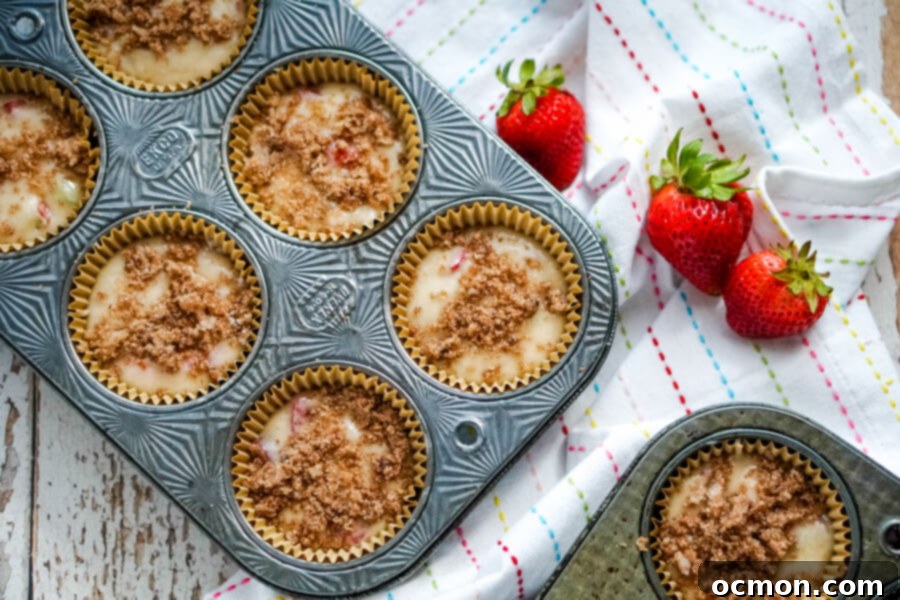 Sweet and Tangy Strawberry Rhubarb Muffins 6 Adding the cinnamon streusel topping to the strawberry rhubarb muffins before baking.