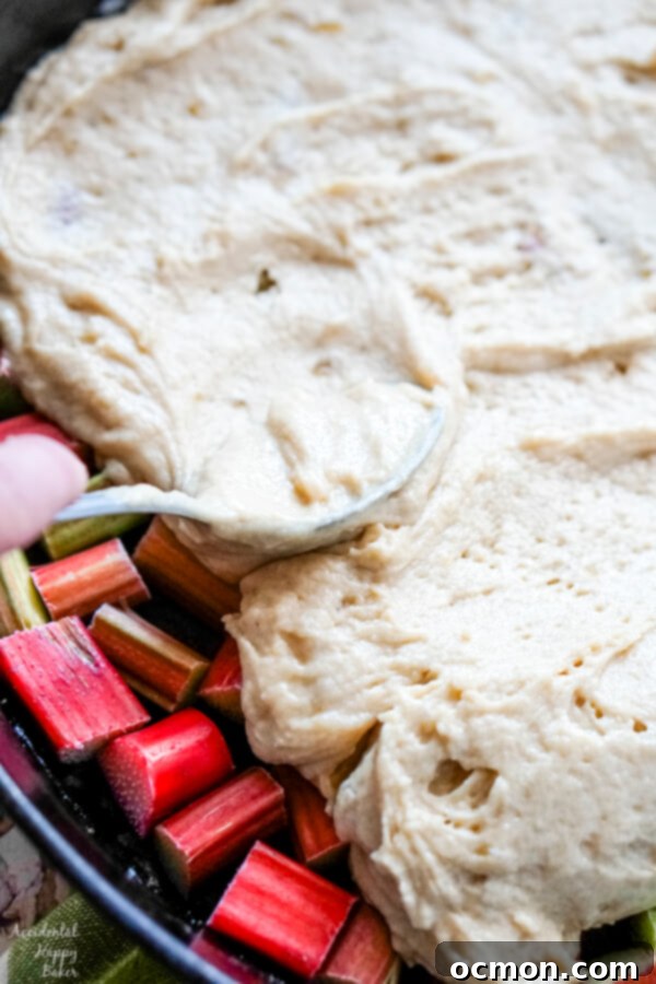 Zingy Rhubarb Ginger Upside Down Cake 7 The cake batter is spread over the rhubarb.