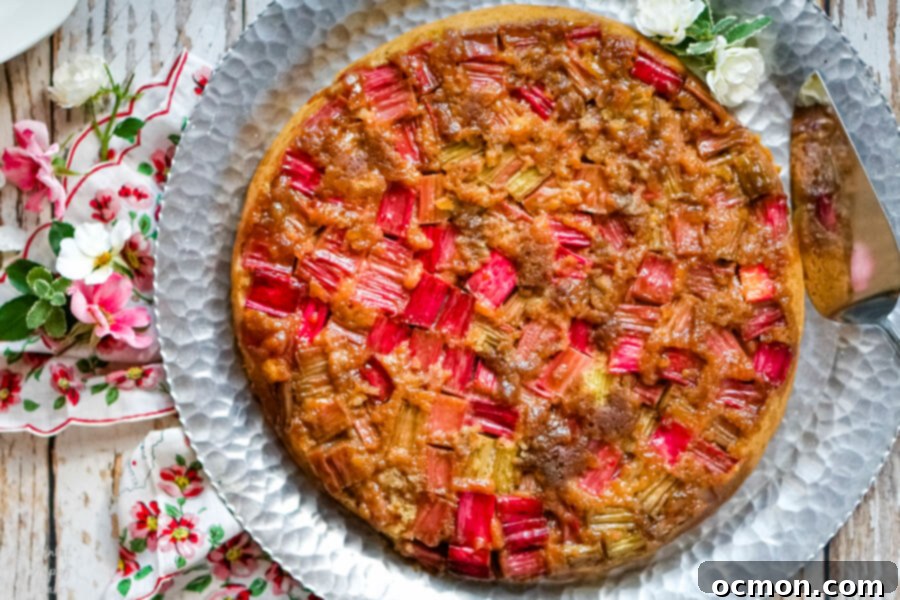 Zingy Rhubarb Ginger Upside Down Cake 8 Rhubarb Ginger Upside Down Cake on a silver serving platter.