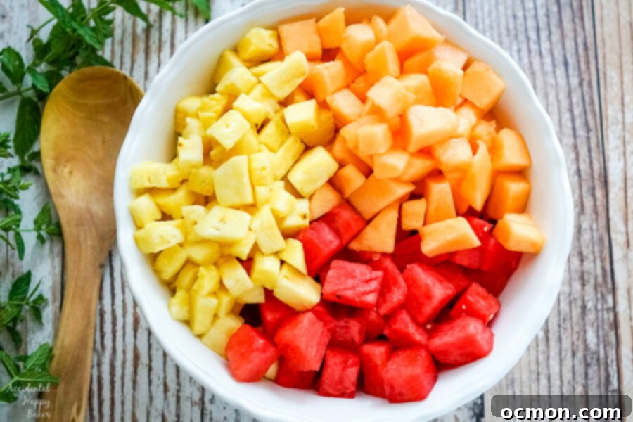 Summer Watermelon Bliss 3 A large white bowl full of chopped watermelon, cantaloupe and pineapple