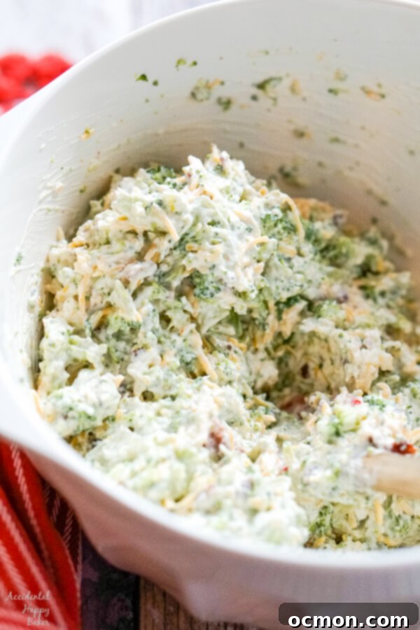 A white mixing bowl holding the mixed dip ingredients. 