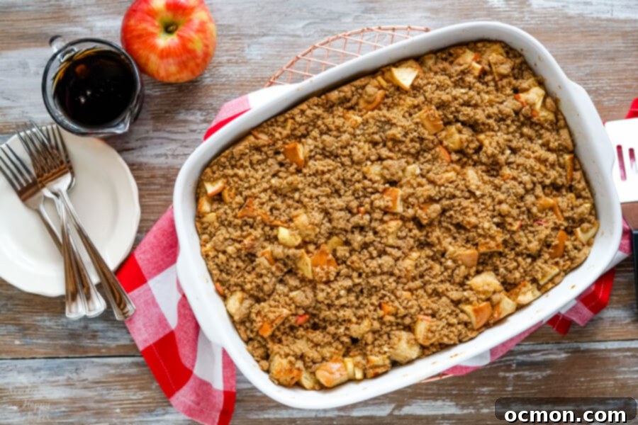 Warm Cinnamon Apple French Toast Bake 9 A freshly baked pan of Cinnamon Apple French Toast Casserole with a red checked towel underneath.