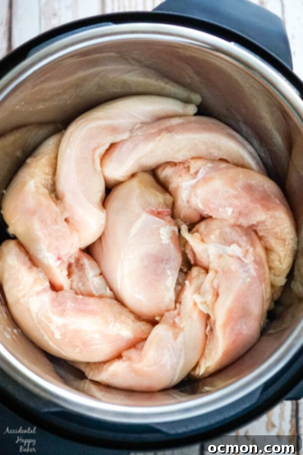 The chicken is placed on it's side in the instant pot to maximize space. 