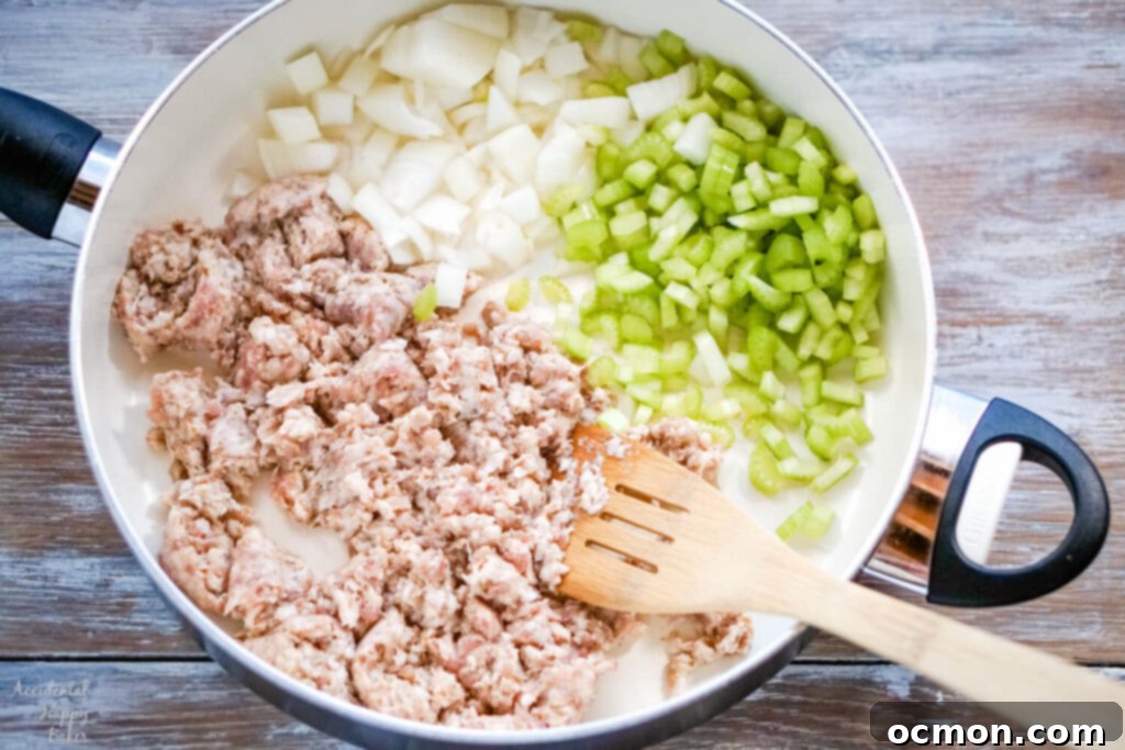 The sausage is browned with the chopped celery and onion. 