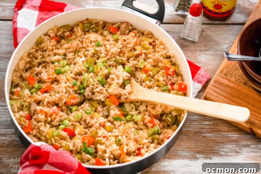 A skillet of rice on top of a red checked towel next to salt and pepper shakers. 