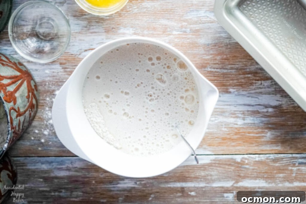Golden Nectar Loaf 4 Golden honey and a bottle of beer are poured into a mixing bowl containing the dry ingredients, ready to be incorporated into the beer bread batter.