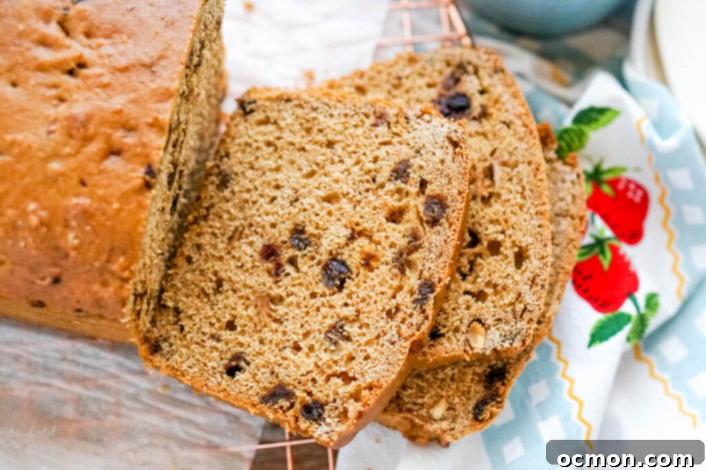 Welsh Bara Brith Tea Bread 4 A close-up view revealing the moist, speckled texture of sliced Bara Brith, showing the plump dried fruits throughout.