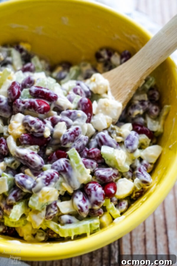 Grandma's Classic Egg Salad 3 A vibrant kidney bean salad, freshly mixed with its dressing, showcasing the rich colors and textures of the ingredients. A perfect side dish.