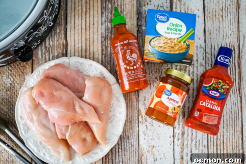 The ingredients needed to make Catalina Chicken: chicken breasts, Catalina dressing, apricot preserves, onion soup mix, and sriracha sauce