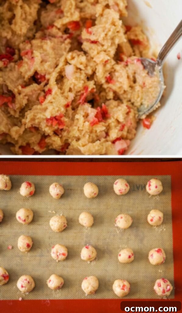 A bowl of truffle mixture with chopped strawberries folded in, ready for portioning.