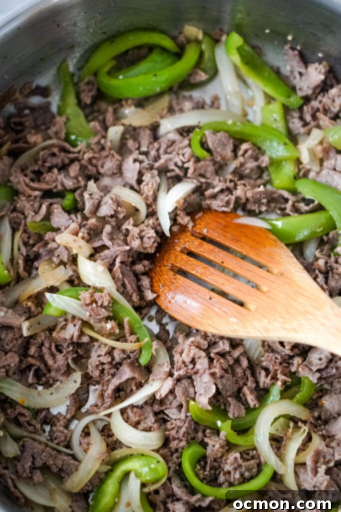 Cheesesteak Stuffed Tortellini 5 The steaks, onions, and peppers and stirred together with a wooden spoon.