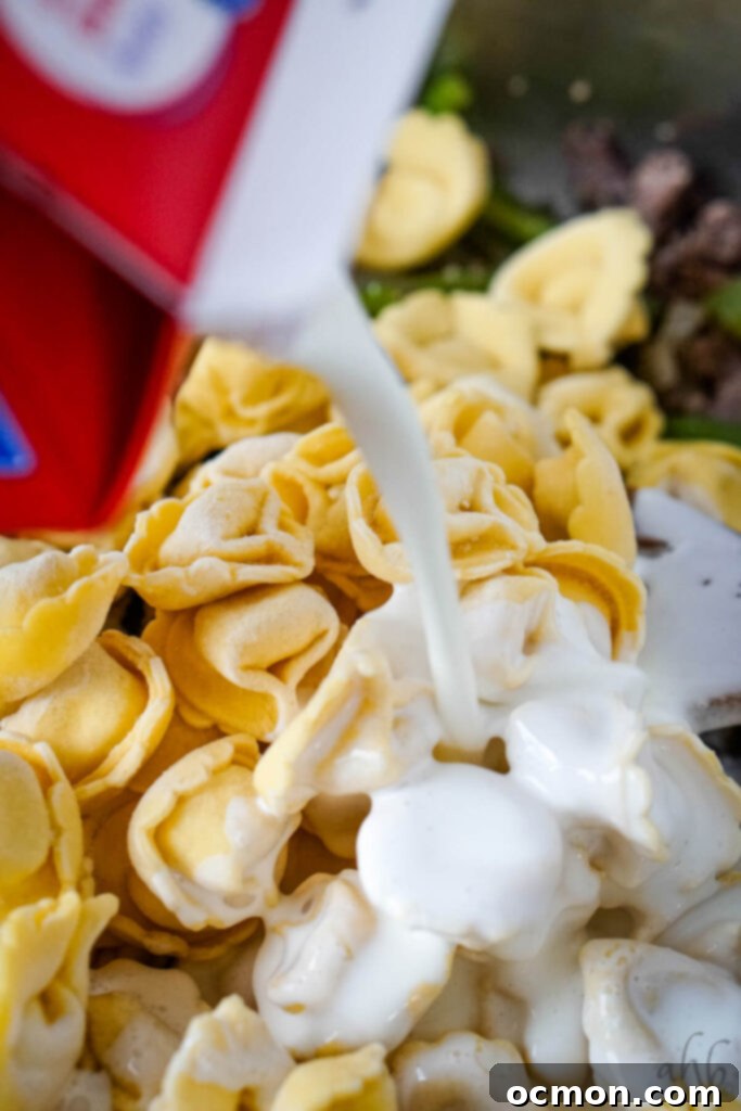 Cheesesteak Stuffed Tortellini 6 The frozen tortellini and heavy cream are added to the pan.