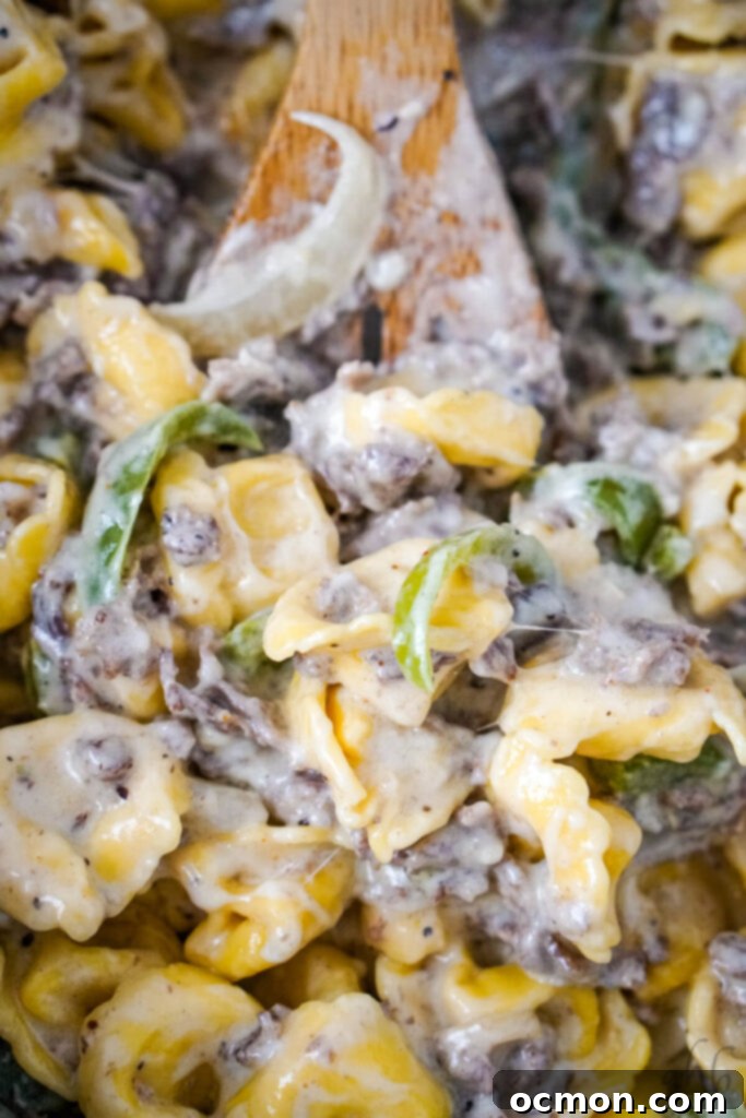 Cheesesteak Stuffed Tortellini 7 Shredded cheese is stirred into the mixture.